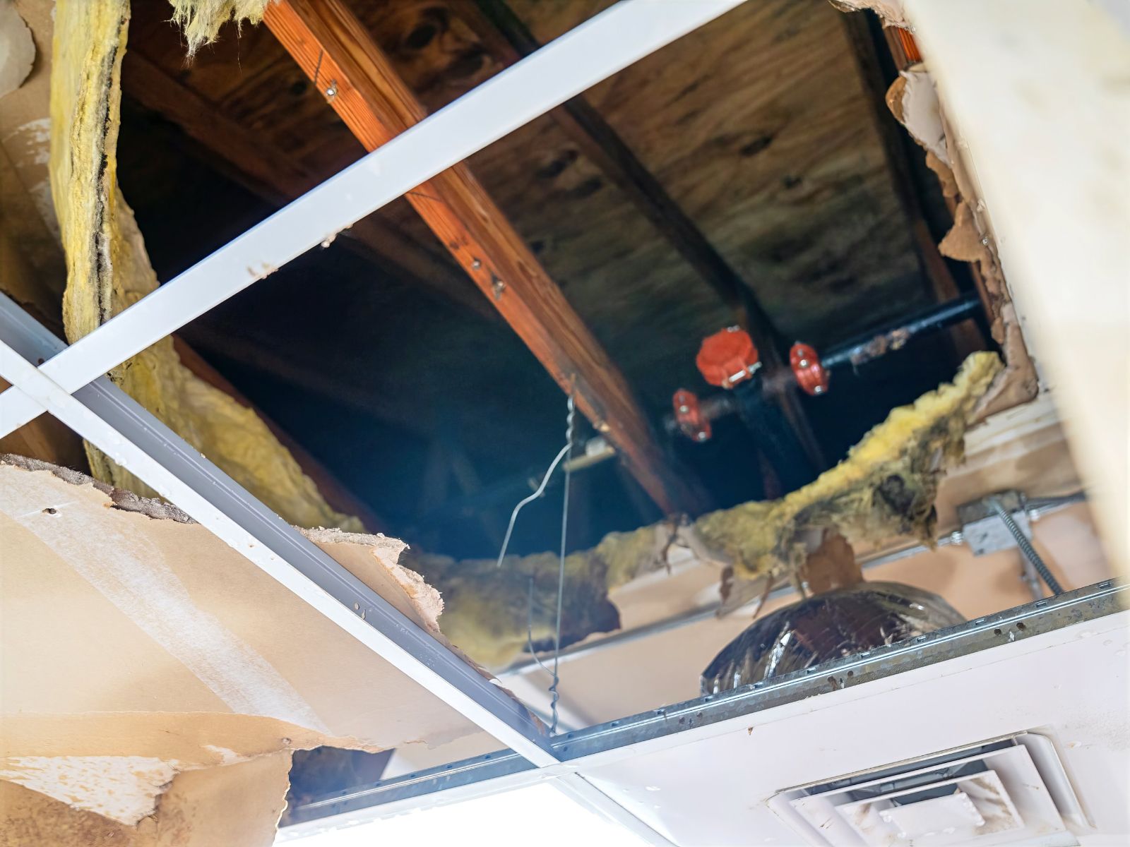 Hole in the ceiling at The Bridge after a burst pipe